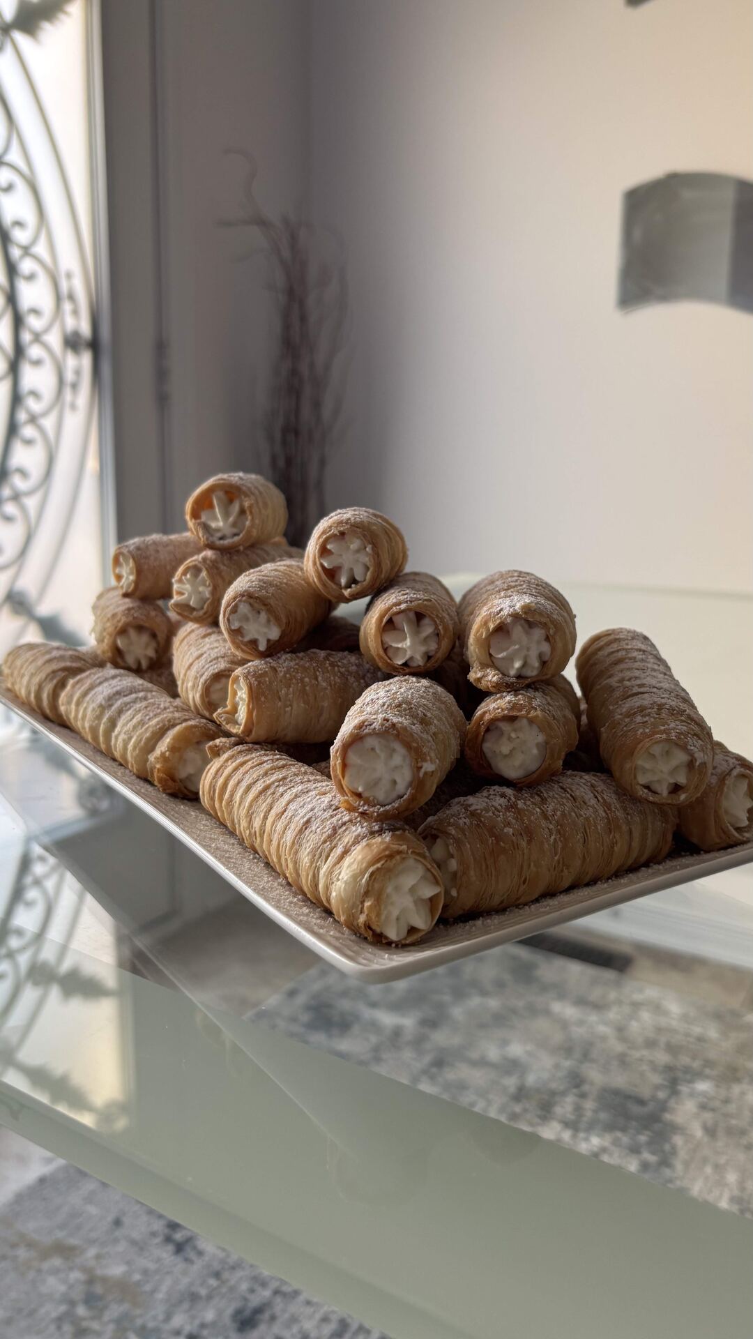 Forty PastryVille cream rolls piled high for a party