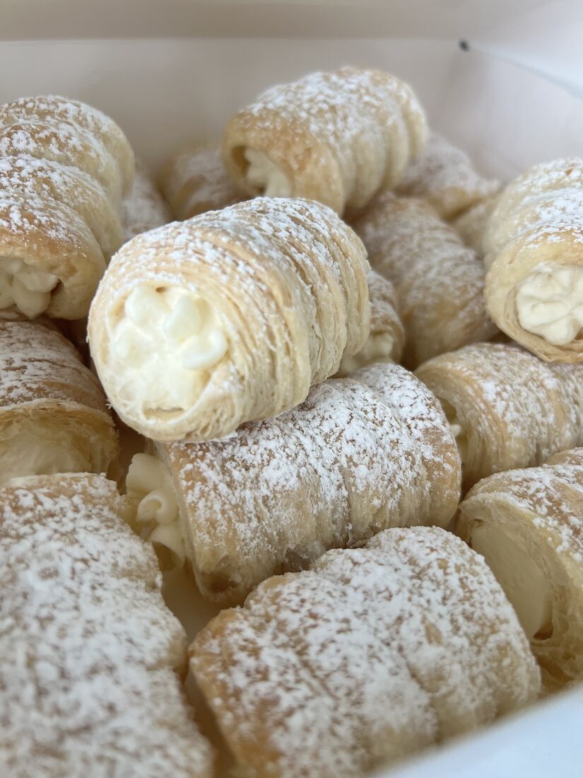 Cream roll cut open showing the whipped filling