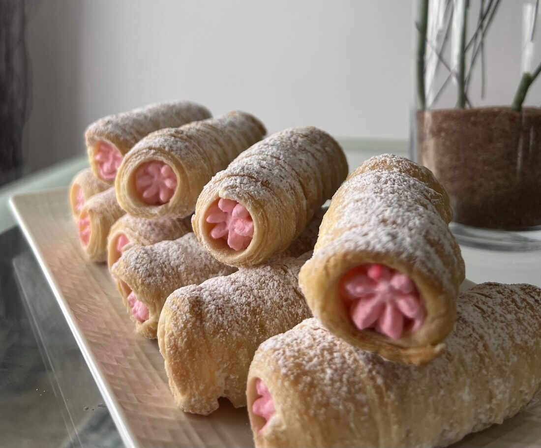 Cream rolls filled with pink strawberry cream